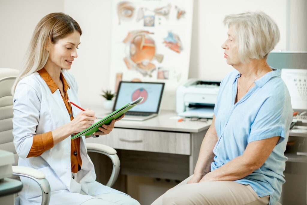 Senior patient with ophthalmologist in the office