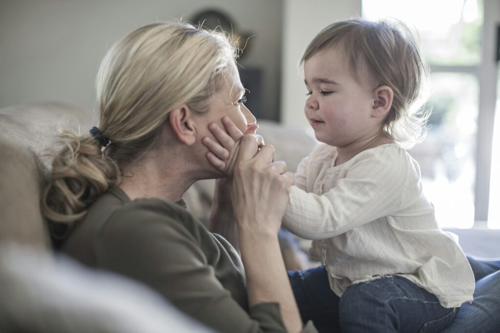 Mother and baby girl at home